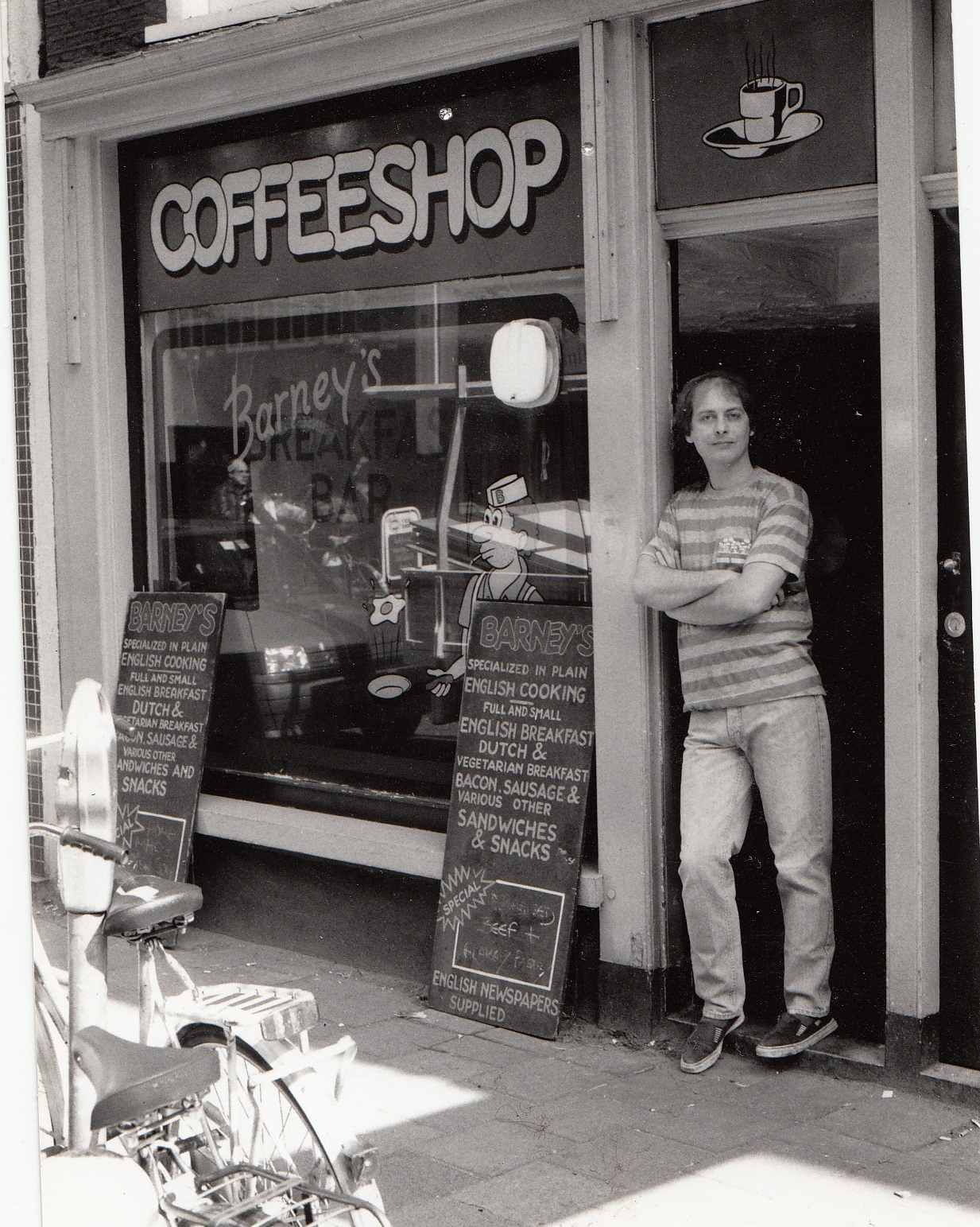 Enlarged detail of the 1986 menu board advertising English breakfast, Dutch and vegetarian breakfast, bacon, sausage, sandwiches, snacks and English newspapers supplied.